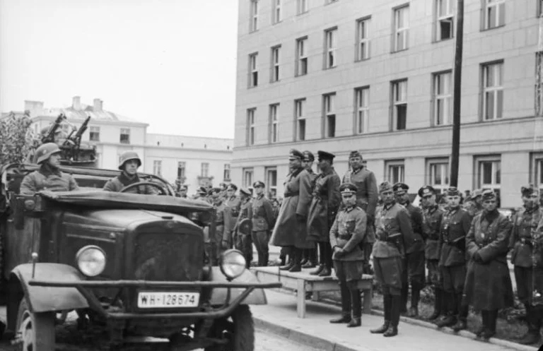 German and Soviet officers standing together beside a military vehicle during the Brest-Litovsk parade, 22nd September 1939