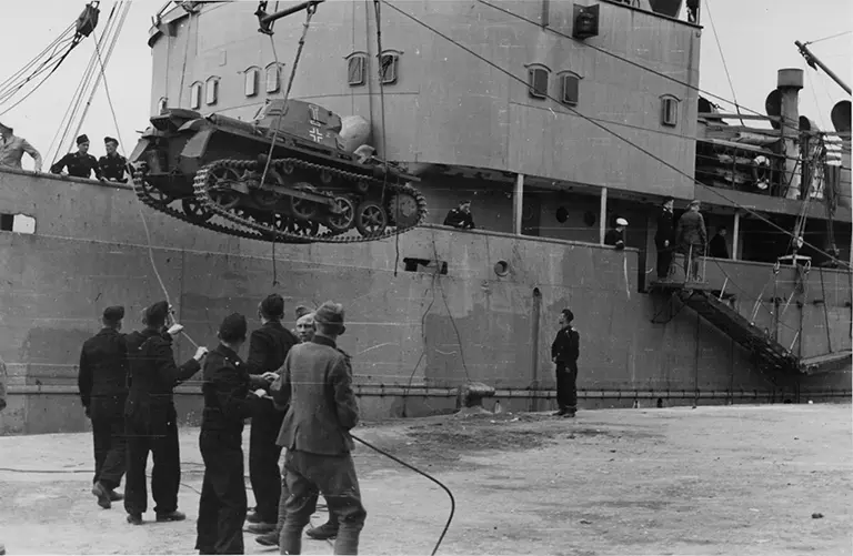 German Panzer I light tank being unloaded by crane from a transport ship at Tripoli harbour during Operation Sonnenblume, March 1941