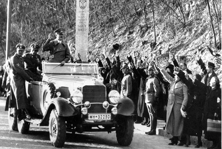 Adolf Hitler entering Austria during the Anschluss, March 1938, greeted by supporters
