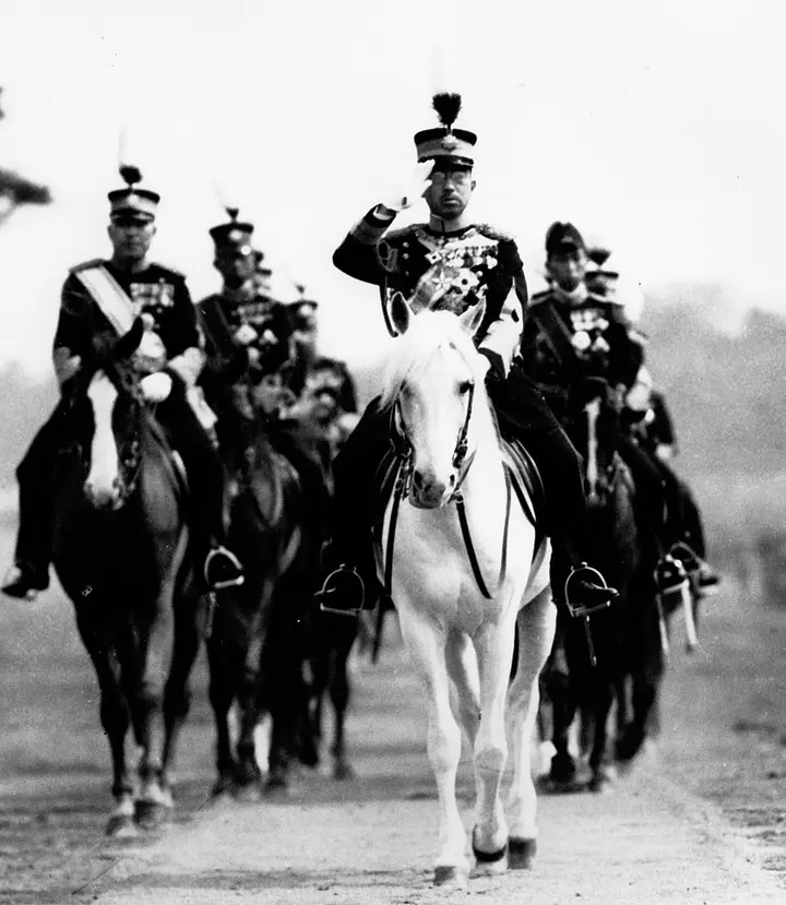 Emperor Hirohito on horseback reviewing Japanese troops during a military inspection, 1937