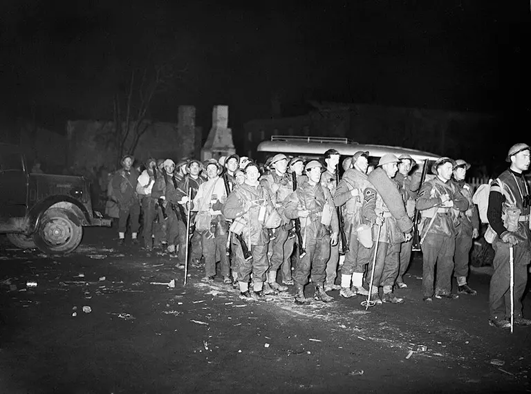 British troops assembled on the quay at Namsos, Norway, preparing for evacuation under Luftwaffe attack during Operation Weserübung, 2 May 1940